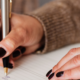 Woman writing in her planner